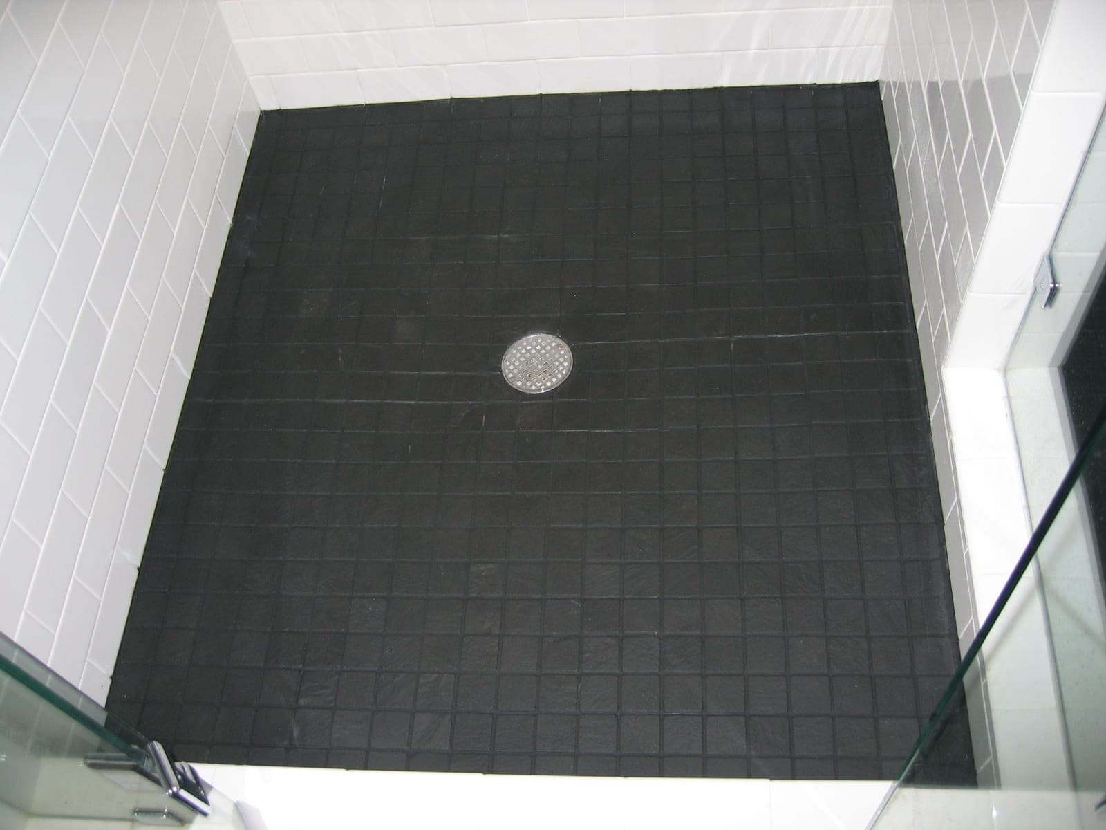 After: Shower floor, soap scum and scale stripped