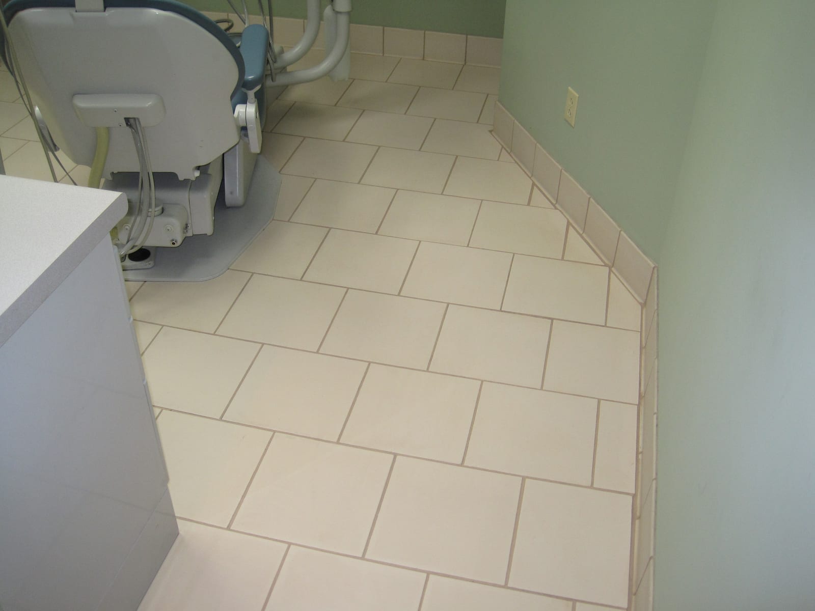 Dental office tile floor after cleaning and color sealing